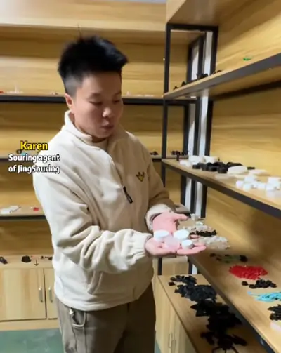 Sourcing agent Karen hold plastic finished parts